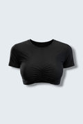 The Saint 54 black fitted cropped shirt with an oval neckline and vertical gathering detail in soft stretch fabric.