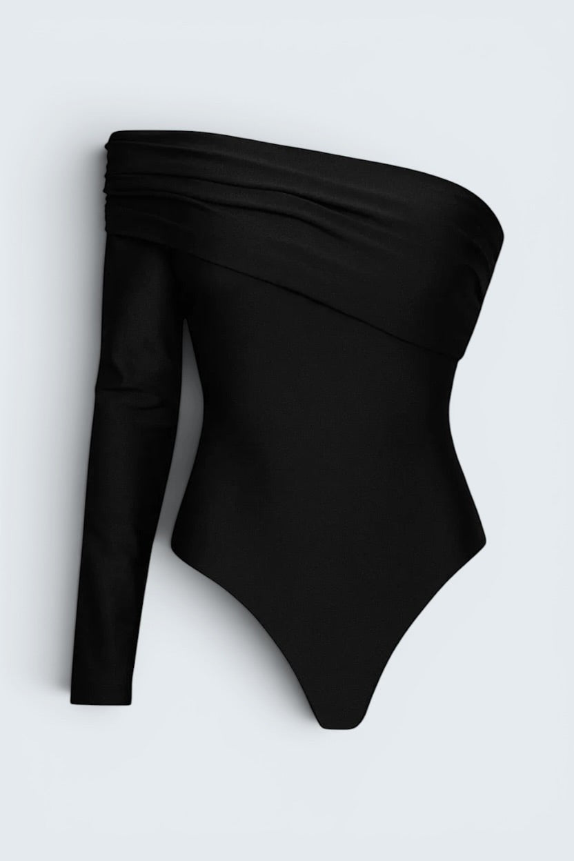 The Saint 54 black long-sleeve bodysuit with one-shoulder draped neckline and sculpting elastic fabric.
