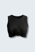 The Saint 54 black sleeveless crop tank top with a crew neck and a central fabric flower detail in a slim fit.