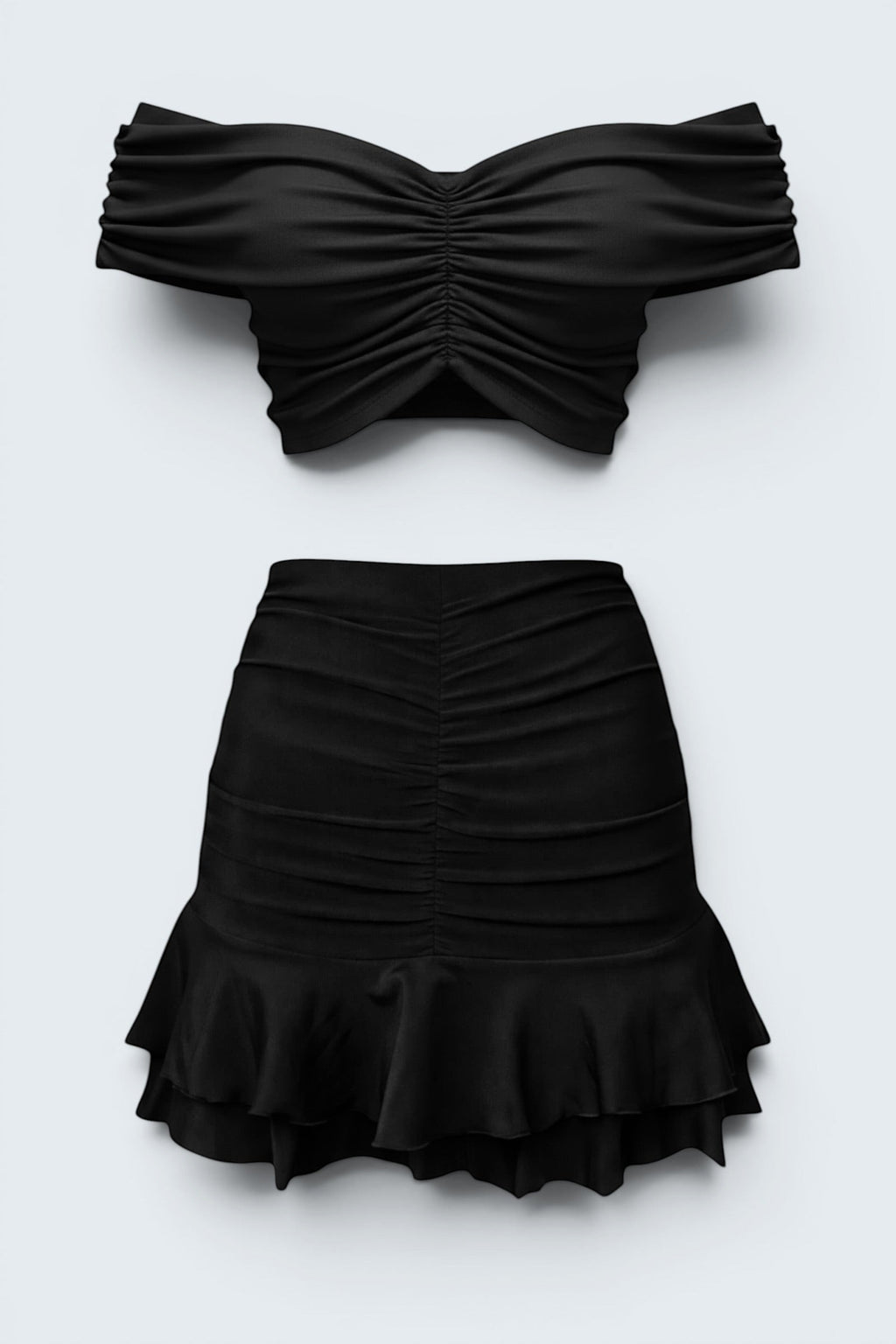 The Saint 54 black two-piece set featuring a gathered off-shoulder cropped top and a ruffled mini skirt.