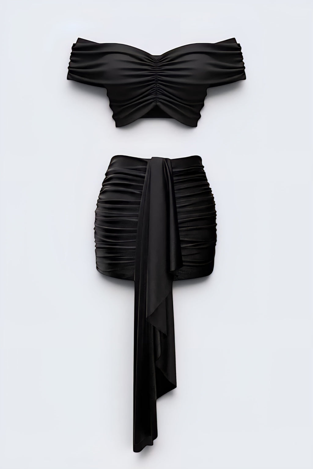 The Saint 54 black two-piece set with off-shoulder gathered crop top and high-waisted mini skirt with draped scarf
