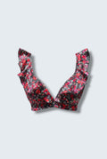 The Saint 54 Give&Shine floral print bikini top with statement ruffle straps and a picot edge finish.