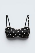 The Saint 54 black and white polka dot bustier top with delicate ecru lace trim and adjustable spaghetti straps.