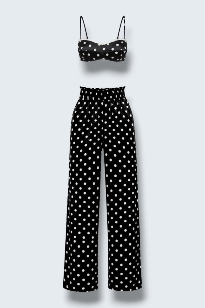 The Saint 54 Set Dolce Vita N2 featuring a black and white polka dot crop top and matching high-waisted wide-leg trousers.