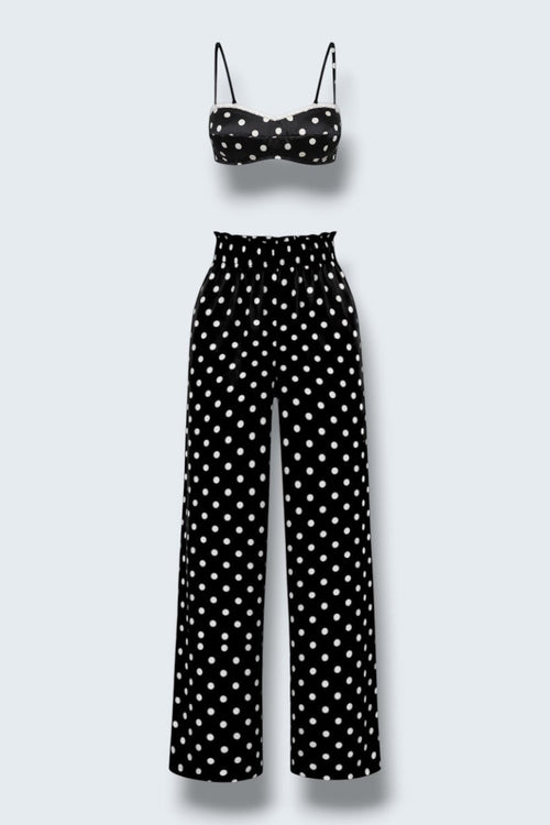 The Saint 54 Set Dolce Vita N2 featuring a black and white polka dot crop top and matching high-waisted wide-leg trousers.