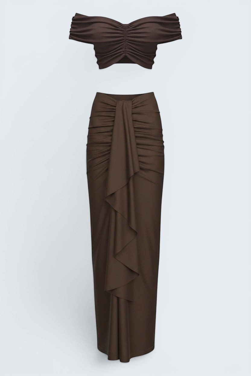 The Saint 54 brown ruched off-shoulder crop top and draped maxi skirt set.