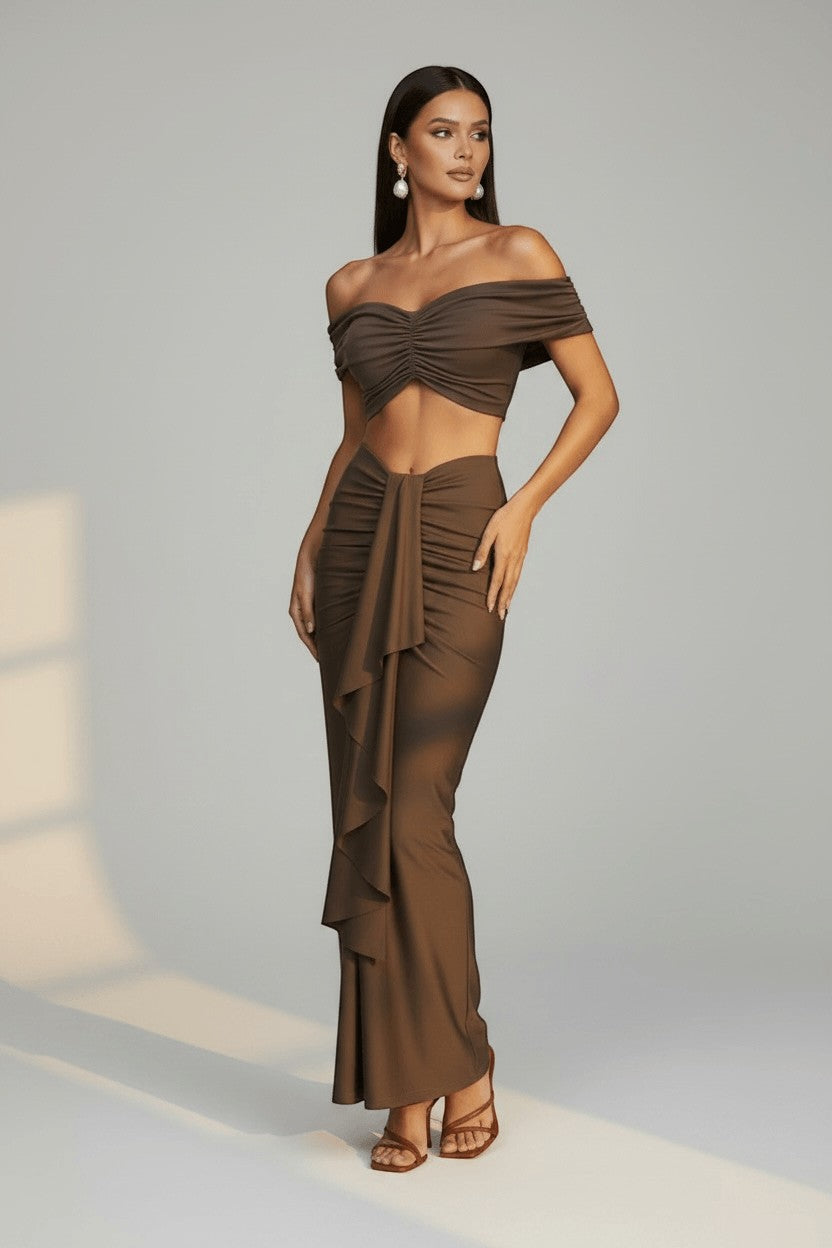 The Saint 54 brown ruched off-shoulder crop top and draped maxi skirt set